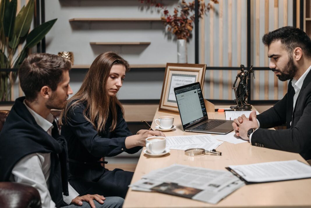 Photo by Pavel Danilyuk: https://www.pexels.com/photo/clients-and-employee-sitting-by-table-at-office-8112158/